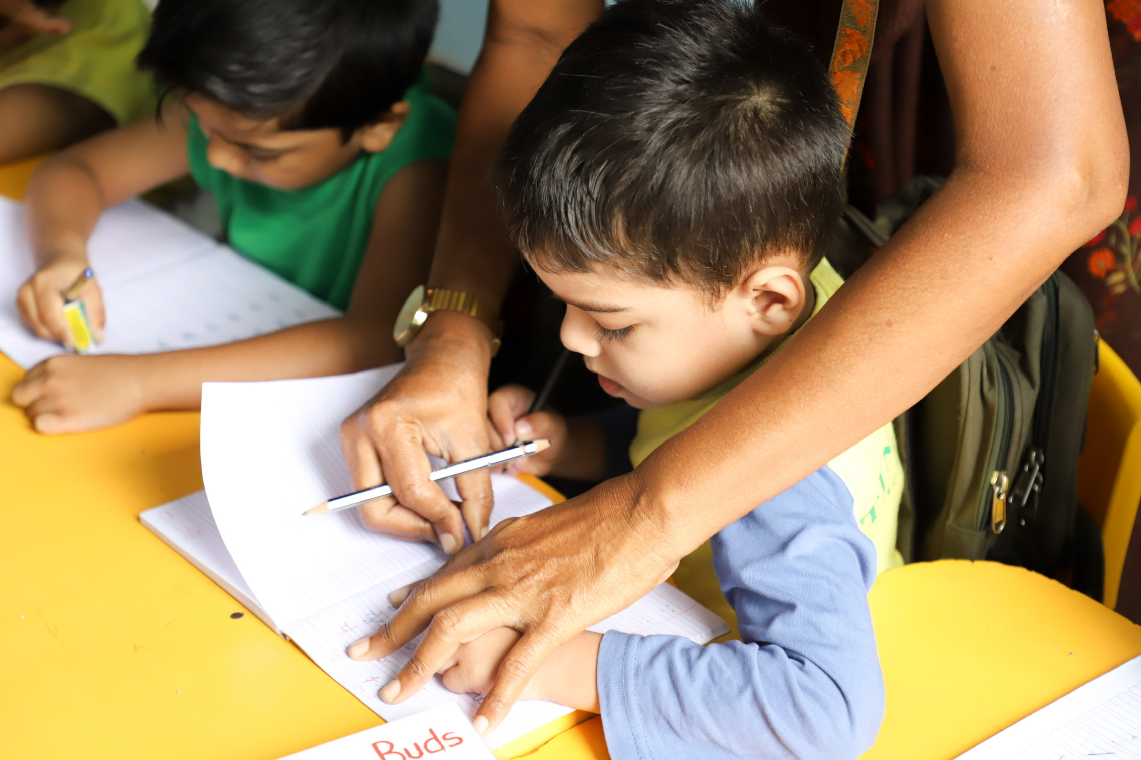 Teachers and children playing